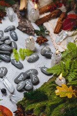 Runes on stones among autumn leaves