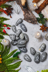 Runes on stones among autumn leaves