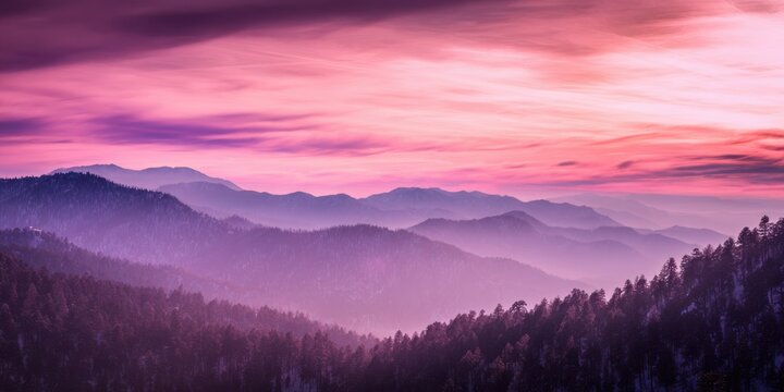 Majestic mountain ranges shrouded in vibrant pink and purple dawn sky with atmospheric haze landscape - Powered by Adobe