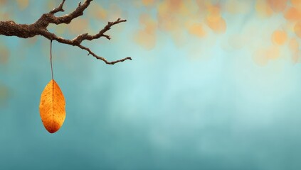 A solitary, autumnal leaf hangs suspended from a bare branch against a soft, pastel backdrop.