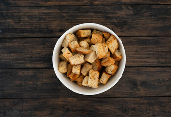 Closeup of crunchy, delicious croutons in a white bowl, perfect for enhancing salads and soups with texture