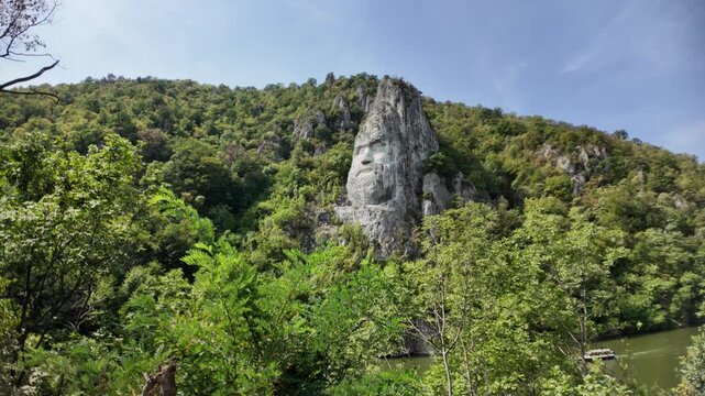 Decebalus Rex rock sculpture, a monumental carving of the Dacian king, standing proudly carved into the cliff face overlooking the Danube River at the Iron Gates gorge in Romania