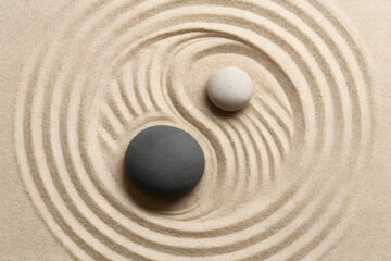 Zen sand garden with black and white stones creating harmony