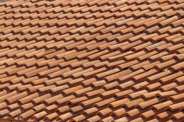 Roof red tiles as background.