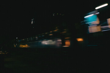 Blurred Night Train Moving Through City