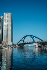 Naklejka premium Sokcho harbor with fishing boats and modern skyscrapers, South Korea