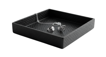 Elegant black tray with silver necklace and ring isolated on transparent background, showcasing jewelry display and storage solution with a modern and minimalist aesthetic