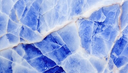 Obraz premium Close-up view of a vibrant blue stone surface with intricate, fractured patterns, showcasing a captivating interplay of light and shadow.