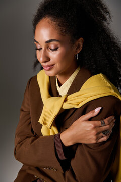 Captivating autumn fashion on a beautiful African American woman in a studio setting