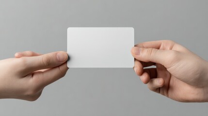 Two hands exchanging blank white business card