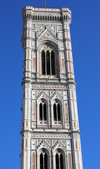 Fototapeta premium tall bell tower of artist Giotto and blue sky in Florence in the Tuscany region of Italy
