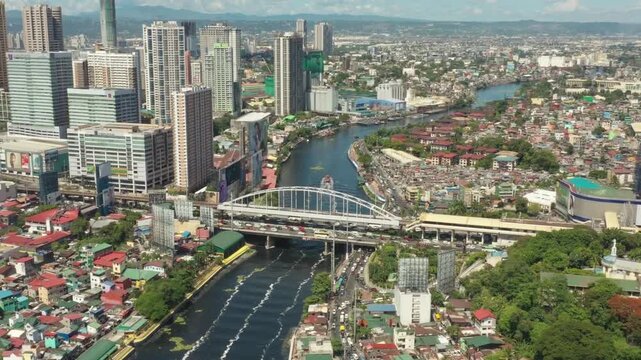 Aerial view of manilas cityscape with a bridge over the pasig river