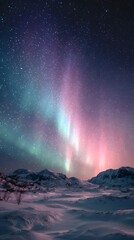 Stunning aurora borealis over snowy mountain landscape
