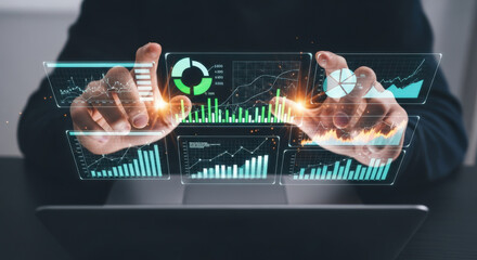 Interactive Data Visualization and Business Intelligence A Person Holding Holographic Charts and Graphs Above a Laptop Illustrating Advanced Data Analysis