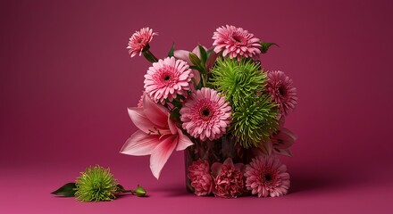 Arrangement of pink and green flowers on pink background