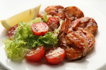 Tasty grilled shrimps with salad on table, closeup. Delicious seafood dish