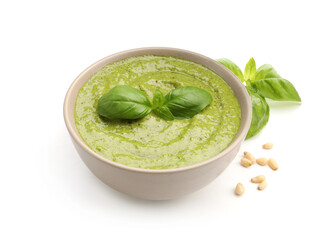 Fresh pesto sauce, basil and pine nuts isolated on white