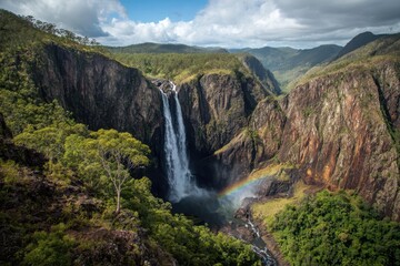 Majestic Wallaman Falls: A Scenic Queensland Gorge with Spectacular Rainbow and Lush Trees