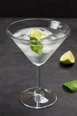 Misted wine glass with lime, mint and ice