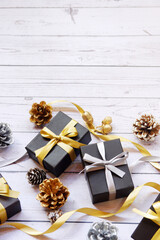 Christmas gift boxes and decorations on wooden table. Preparation for holidays. Copy space. Christmas background.