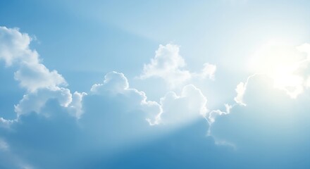 Blue sky cloudscape featuring sunlight and heavenly elements