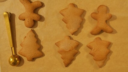 Baking Homemade Holiday Gingerbread Cookies on Parchment Paper
