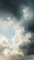 Obraz premium A captivating cloudscape with sunlight piercing the dramatic clouds, creating a striking sky backdrop. This atmospheric weather phenomenon evokes feelings of hope and renewal, highlighting the power