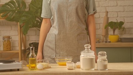 Chef Preparing Ingredients in a Modern Kitchen for Baking