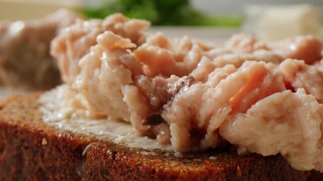 Cod liver superfood can, omega 3 Smoked cod liver in oil in open tin can with fresh greens on wooden table. Seafoods delicacy