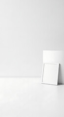 Empty White Photo Frame Against a Wall in a Bright Minimalist Studio