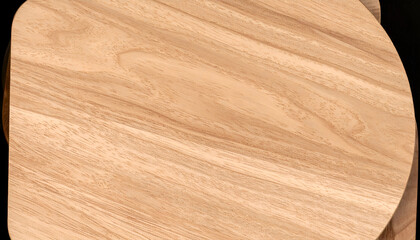 Fototapeta premium Close-up view of a uniquely shaped wooden cutting board, showcasing its natural grain.