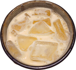 Top view of iced coffee with milk and ice cubes