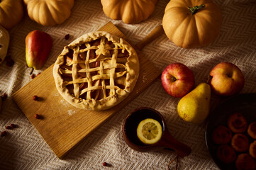 Autumn Harvest Still Life With Pumpkin Pie, Fresh Fruit, And Cozy Tea on a Woven Table