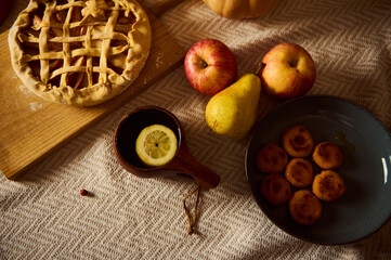 Autumn Table Scene With Lattice Pie, Fresh Fruit, And Small Pastries For Thanksgiving