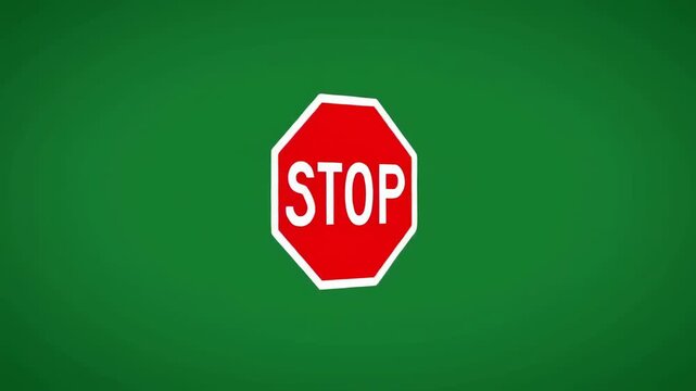 Red octagon stop sign on a solid green background