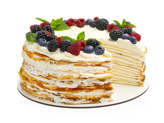 Tasty crepe cake with berries and mint isolated on white