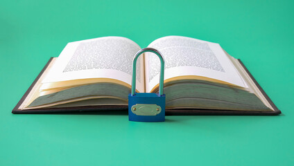 Padlock on the book. Information security concept.
