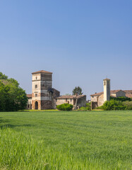 Abandoned rural building dominating green wheat field in Pojana Maggiore, Veneto, Italy