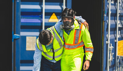 Engineer wear PPE urgently assisted the male technique inside container as Chemical spill in the container shipping industry.