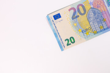 Close-up of a 20 euro banknote on a white background, representing money, finance, savings, currency, or economic value.