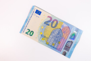 Close-up of a 20 euro banknote on a white background, representing money, finance, savings, currency, or economic value.