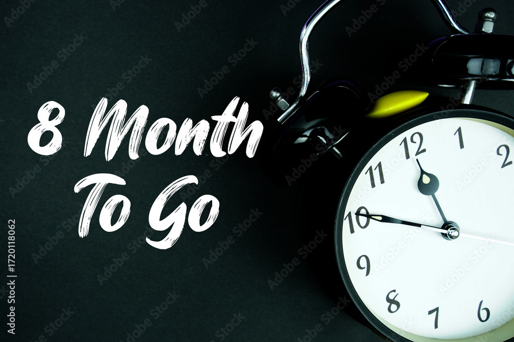 Poster 8 month to go text and alarm clock on black background
