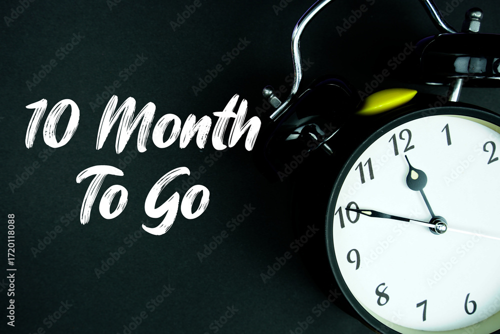 Poster 10 month to go text and alarm clock on black background