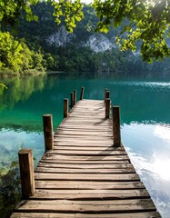 Naklejka premium Serene lake pier under canopy of trees