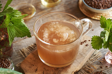 Homemade flax seed gel, nettle leaves, argan oil, apple cider vinegar - ingredients for natural diy shampoo.