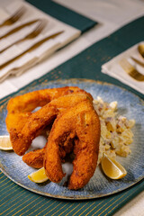 Traditional Christmas dinner in Czech Republic - fried carp with potato salad