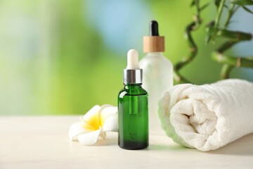 Beautiful spa composition with cosmetic product on white wooden table against blurred background, closeup