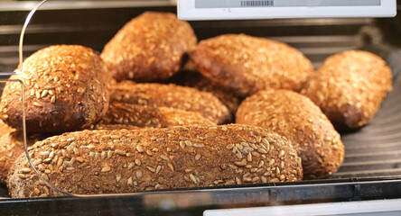Freshly baked multigrain bread rolls - A Bakery Display with a Variety of Healthy Wholegrain Buns