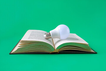 Light bulb on an old book background.Education concept.