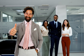 Business team smiling together with leader showing positive motivation and confidence